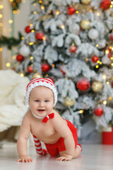 Baby boy in christmas decoration room