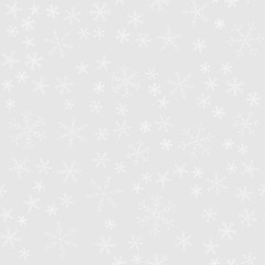 Snowflakes of different kinds on a background of gray, pattern