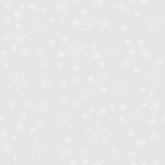 Snowflakes of different kinds on a background of gray, pattern