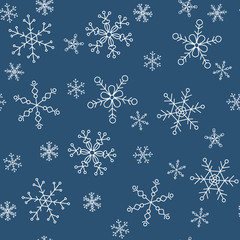 Snowflakes of different styles on a background of blue, pattern