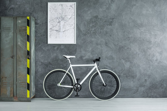 White bicycle in dark room