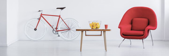 Red bike in stylish studio