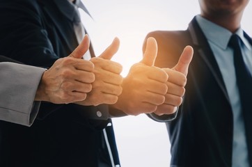 group of business people team showing thumbs up as like sign together in office, successful, support, meeting, partner, teamwork, community, connection concept, vintage color tone, sunlight effect