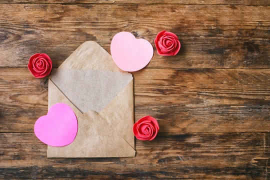 Valentine's day composition, envelope with blank note, heart shape sticker