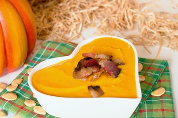 Pumpkin soup in heart shaped bowl