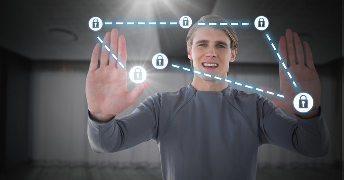 Businessman holding hands up to security lock icons connecting