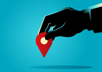 Businessman hand holding a map pin