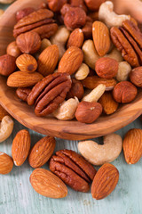 mixed nuts on wooden surface