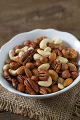 mixed nuts on wooden surface