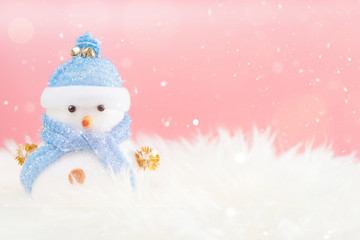 Happy snowman standing in winter christmas snow background. Merry christmas and happy new year greeting card with copy-space. Christmas celebration holiday background.
