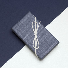 Gift box wrapped in elegant style with blue and milk colors