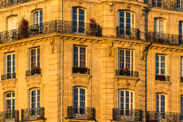 Haussmannian building facade at sunset on Ile de la Cite. 4th Arrondissement, Paris, France
