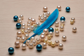 blue feather with beads