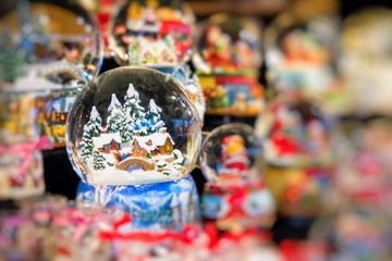 Various Christmas snow globes at a Christmas market in Berlin, Germany.