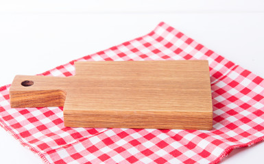 Wooden kitchen board on the table