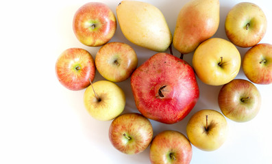 Group of colorful ripe fruits in form of hearton white background with copy space.