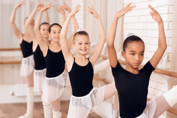 Young ballerinas rehearsing in the ballet class.