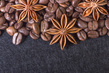 star anise, on the background of coffee with beautiful highlights on the surface of grains