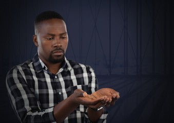 Businessman with hands palm open and dark background