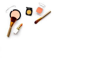 Decorative cosmetics concept. Eyeshadows, rouge on white background top view copyspace