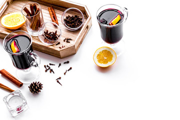 Ingredients for mulled wine. Spices cinnamon and badian, citrus fruits on white background copyspace