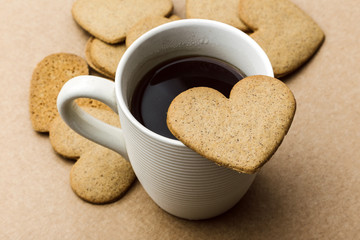 coffee with a heart shaped cookie