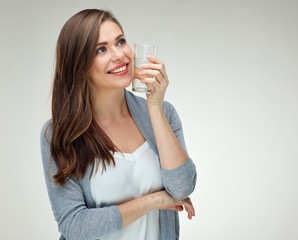 Smiling woman holding water glass. Isolated portrait on white