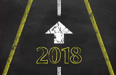 2018 written on the road with arrow