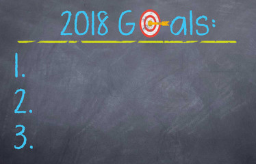 Fototapeta na wymiar 2018 goals with bulls eye written with chalk