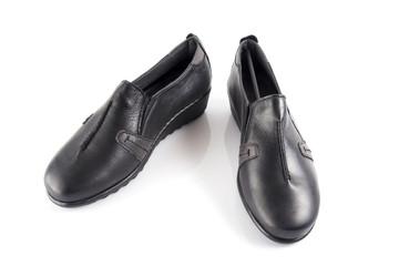 Female black leather shoe on white background, isolated product, comfortable footwear.