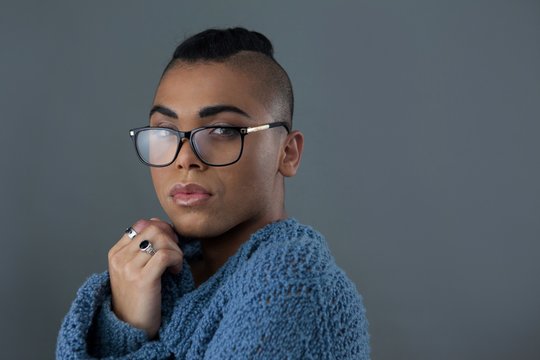 Portrait of transgender woman wearing eyeglasses