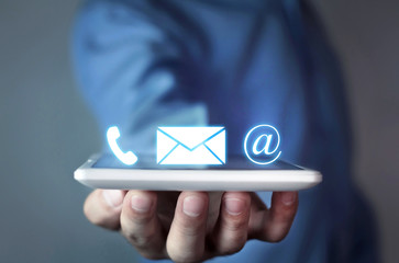 Man holding contact icons.