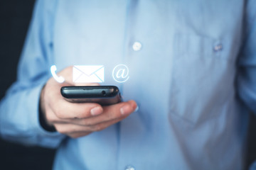 Man holding contact icons.