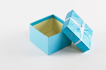 Empty gift box with ribbon on white