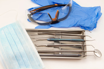 Group of tools and accessories for dental treatment.