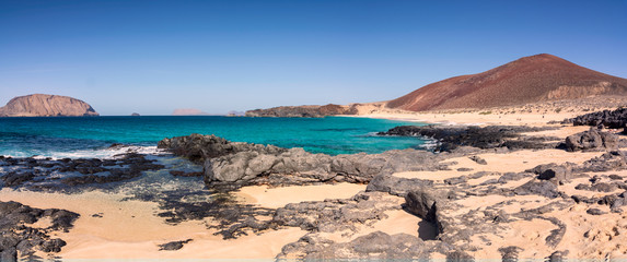 Las conchas beach. Canary islands. Sunny wild bech in La Graciosa. Lanzarote. White sand and...