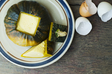 Egg custard in pumpkin for Thai dessert food concept with copy space for your text, Top views