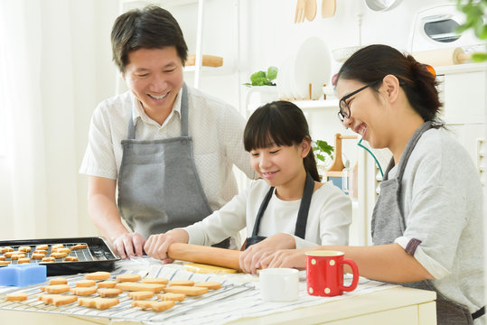 Asian Family Baking Cookies.