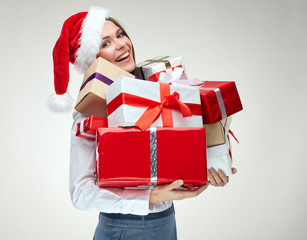 portrait of businesswoman wearing christmas santa hat holding bi
