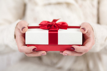 Present box in woman's hands