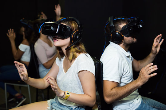 five people immersed in virtual reality with  3d glasses
