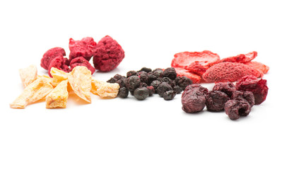 Freeze dried berries mix isolated on white background comparing stacks.