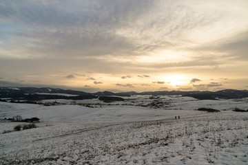 Sunset on meadow with snow during winter. Slovakia