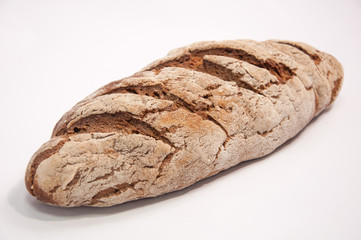 Close-up of a fresh baked rustic bread on white
