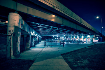 Gritty and scary city skate park at night in urban Chicago.