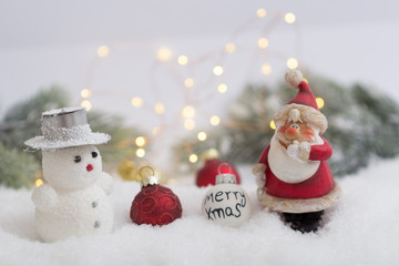 Obraz premium Santa Claus with Snowman in winter