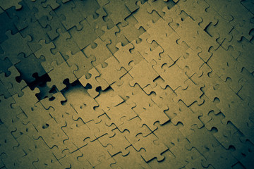 Abstract background. Scattered and stacked puzzles of the same c