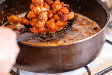 delicious unhealthy fried pork greaves in the pan traditional christmas meal