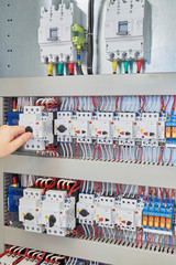 Man switch switch protection engine to check in the electrical Cabinet. In the electrical control Cabinet on a mounting plate fixed circuit-breakers, motor protection relay.
