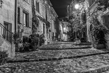 Narrow street in the old town in France at night